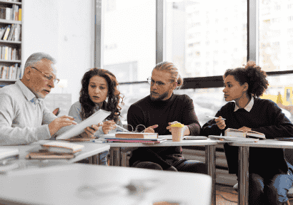 medium-shot-people-sitting-library