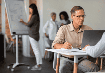 people-using-digital-device-while-meeting
